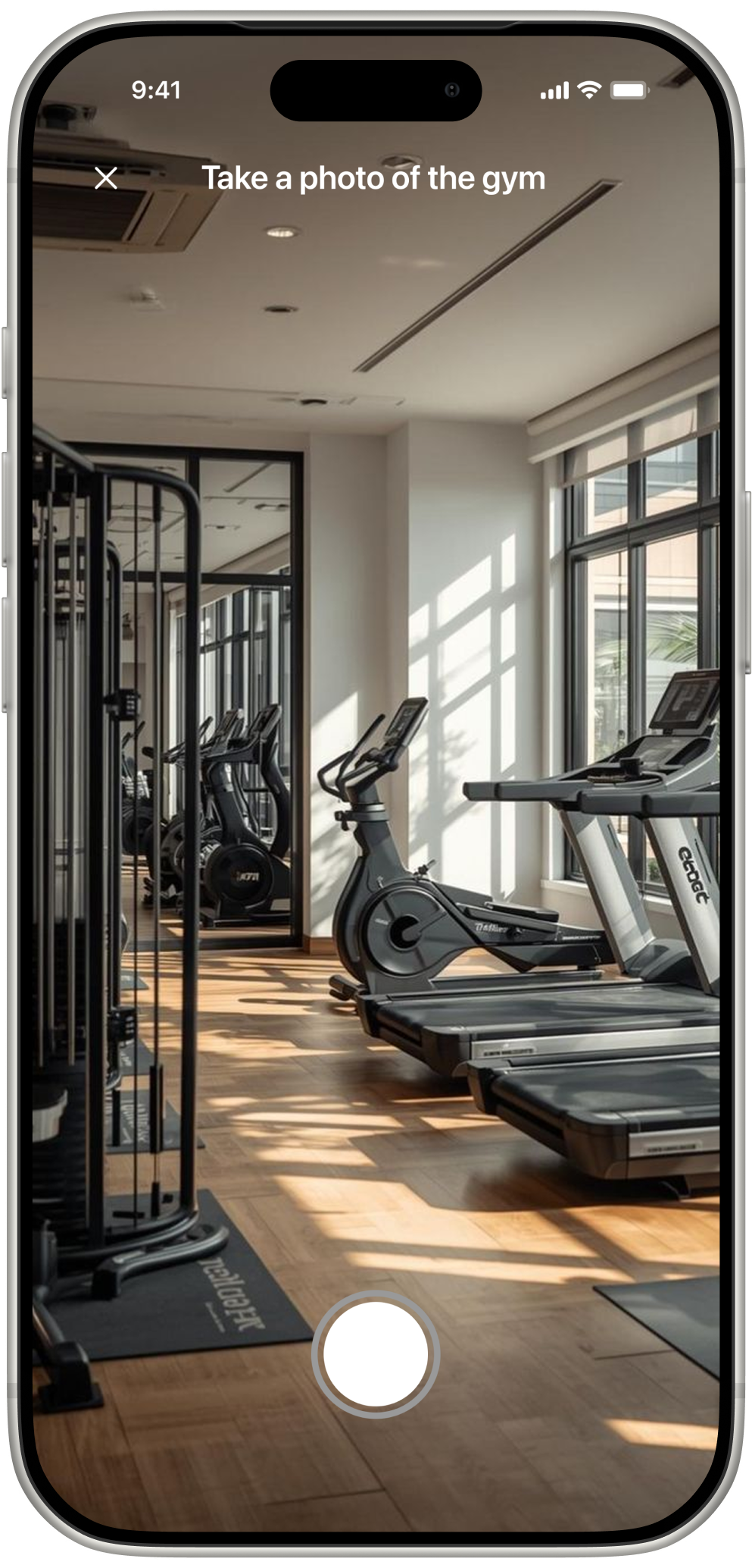 The FitBound camera screen, prompting “Take a photo of the gym” with a shutter button.